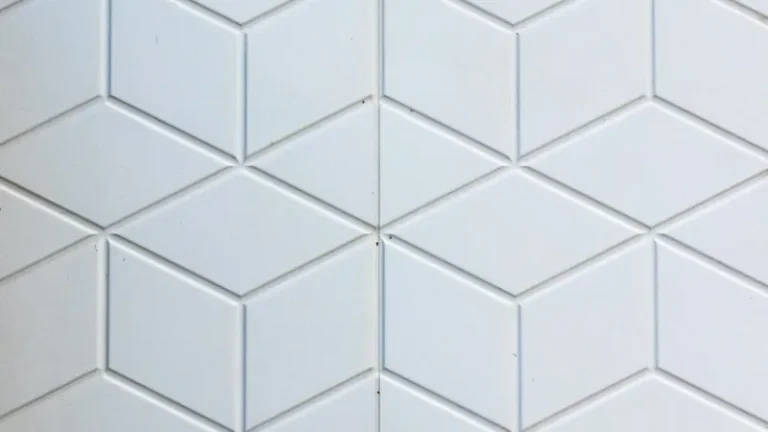 Close-up of geometric bathroom wall tiles, representing bathroom waterproofing and tiling
